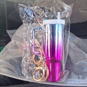 THIS IS A BRAND NEW TUMBLER BAG CHARM THE LID UNSCREWS.YOU CAN PUT STUFF INSIDE.
